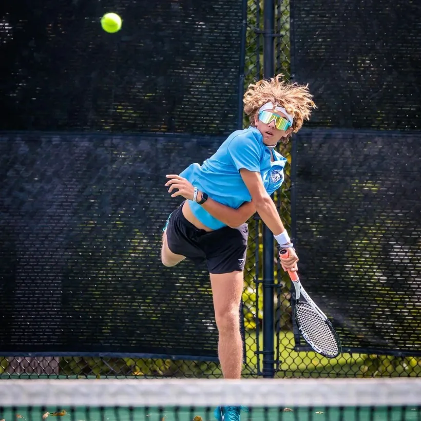 Sam Iannone serving during a tennis match